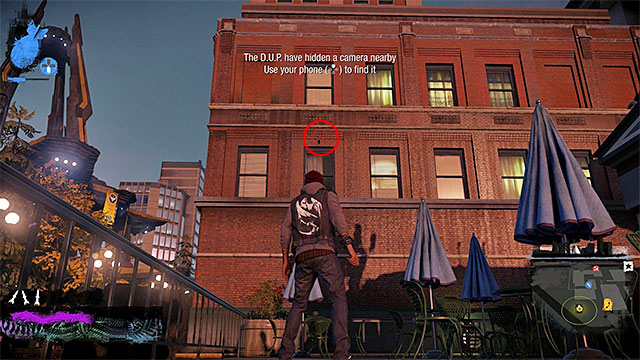 2) Hidden Camera - The camera you seek is in the place shown in the above screenshot - Downtown - more difficult activities - City - inFamous: Second Son - Game Guide and Walkthrough