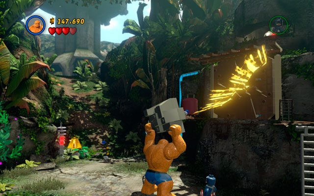 Choose the Thing and lift a rock with green handles attached to it, then throw it at the enemies - Rapturous Rise - Walkthrough - LEGO Marvel Super Heroes - Game Guide and Walkthrough