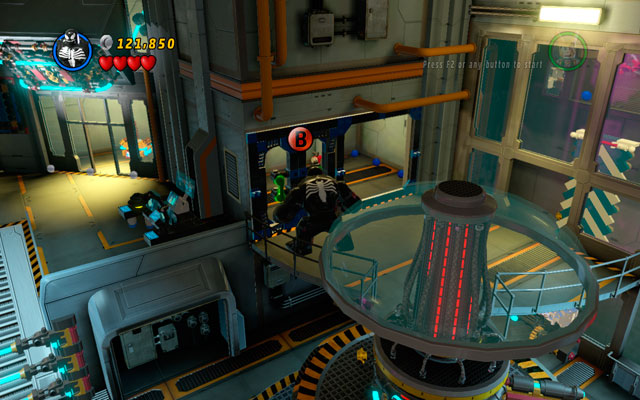 In the room with strange, rotary machine (on the left from the blue-and-white wall) choose any big character and yank the door located on the first floor, using green handles - Rebooted, Resuited - Minikit Sets - LEGO Marvel Super Heroes - Game Guide and Walkthrough