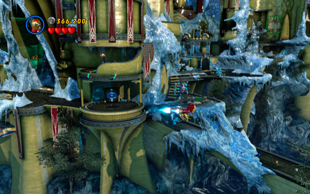 Choose any flying character and fly through the frozen bridge located in the central area of the map - Bifrosty Reception - Minikit Sets - LEGO Marvel Super Heroes - Game Guide and Walkthrough