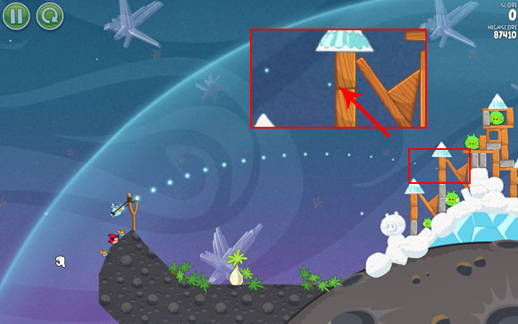 Launch the first bird between the two indicated planks - Level 2-7 - Cold Cuts - Angry Birds Space - Game Guide and Walkthrough