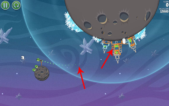 Launch the first bird towards the middle tower, adjusting the flight path a little above the corner of the indicated pattern in the background (you need to zoom-out) - Level 2-18 - Cold Cuts - Angry Birds Space - Game Guide and Walkthrough