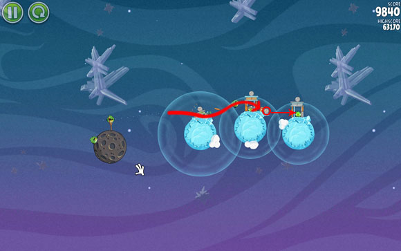 The bird should eliminate the first pig and reach the second planet, where it will hit the box of explosives - Level 2-19 - Cold Cuts - Angry Birds Space - Game Guide and Walkthrough