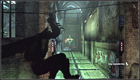 Stand in front of the electrified floor tiles, take out the Line Launcher and shoot it at the wall in the distance #1 - Enigma Conundrum (riddles 16-17) - Side missions - Batman: Arkham City - Game Guide and Walkthrough