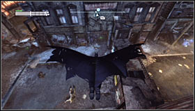 Stand on the roof north of the Trophy #1 and glide towards the wooden wall #2 - Batman trophies (15-24) - Park Row - Batman: Arkham City - Game Guide and Walkthrough