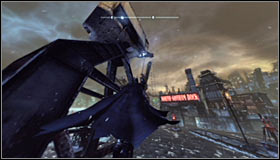 In order to safely leave the cage, you will have to use the Grapnel Boost - Batman trophies (01-10) - Amusement Mile - Batman: Arkham City - Game Guide and Walkthrough