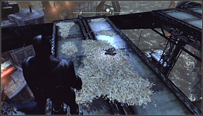 Search for hay on the very top of the drawbridge (screen above) and scan it - Riddles - Amusement Mile - Batman: Arkham City - Game Guide and Walkthrough