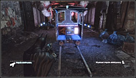 Take out the Remote Electrical Charge and shoot at the engine found inside a small locomotive #1 - Batman trophies (01-08) - Industrial District - Batman: Arkham City - Game Guide and Walkthrough