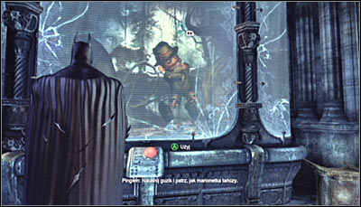 Find the puppet exhibit (screen above), approach it and press the red button to set it into motion - Riddles - Museum - Batman: Arkham City - Game Guide and Walkthrough