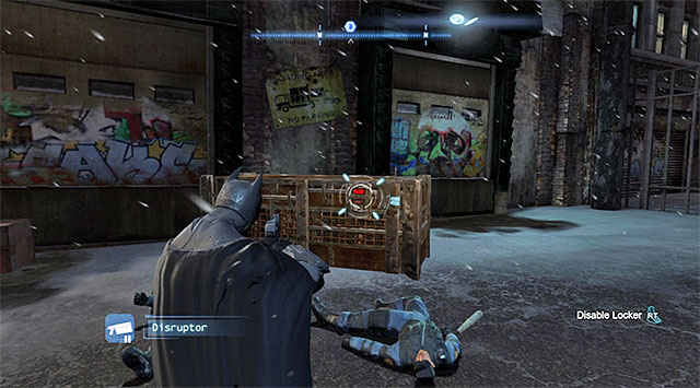 After you have secured the area, select the disruptor from the inventory, target the crate shown in the screenshot and hold down the appropriate trigger/key to compete the process - Penguin - Most Wanted - Batman: Arkham Origins - Game Guide and Walkthrough
