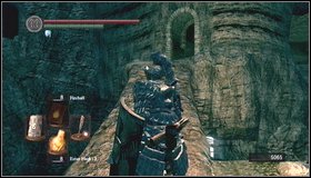 Right after entering the bluish part of the location with the waterfall, you can shoot the necromancer - The Catacombs - p. 1 - Walkthrough - Dark Souls - Game Guide and Walkthrough