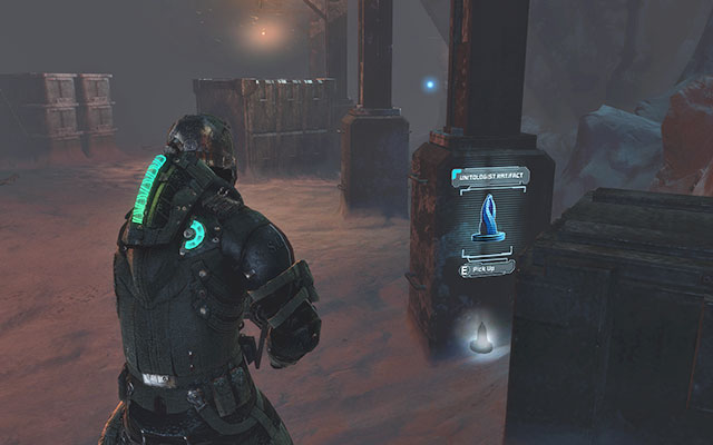 Next to one of the pillars between crates, near the cargo elevator - Chapter 14 - p. 1 - Secrets - Dead Space 3 - Game Guide and Walkthrough