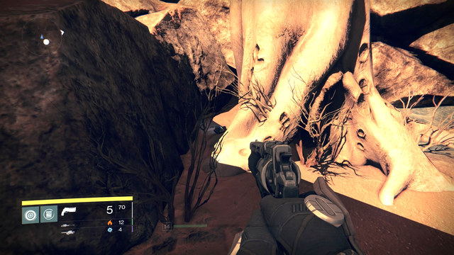 Ghost lying between the roots of a tree behind the passage. - Mars - Dead Ghosts - Destiny - Game Guide and Walkthrough