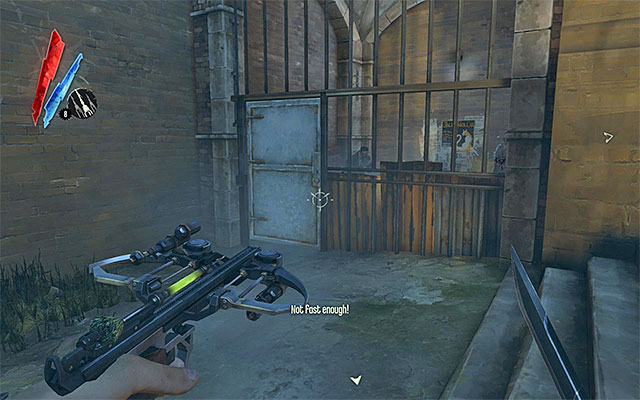 With the key that you have found in the storage room, at your disposal, you may now go outside for a moment and turn your attention to the enclosed area to the left of the building's main entrance (the above screenshot) - Meeting with the Bottle Street Gang leader - Mission 3 - House of Pleasure - Dishonored - Game Guide and Walkthrough