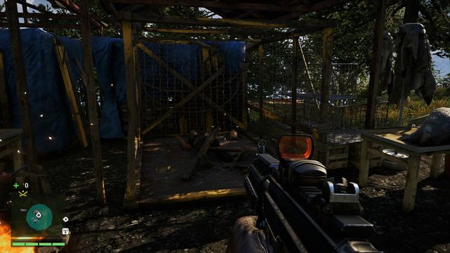 You will find the mask in the corner of a cage near the campfire - Southern and central Kyrat - Yalungas Masks - Far Cry 4 - Game Guide and Walkthrough