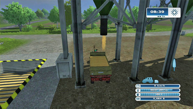Unloading a silo onto the trailer. - Selling crops for the first time - First steps - Farming Simulator 2013 - Game Guide and Walkthrough