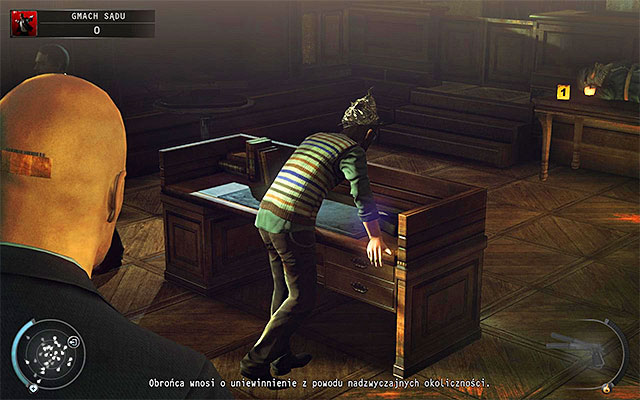 The person, whose identity you can still is Timothy Hawke and you can find him in the courtroom (screen above) - Courthouse - Getting to the holding cells in defendant disguise - 15: Skurkys Law - Hitman: Absolution - Game Guide and Walkthrough