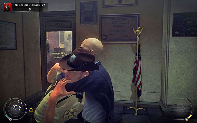 Once you reach its end, stop for few moments and wait until the cop in the room turns around and walks to the left - County jail - 16: Operation Sledgehammer - Hitman: Absolution - Game Guide and Walkthrough