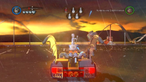 Choose one of the vehicles, get inside, start driving and launch rockets at silver statues (picture) (K key) - Arkham Asylum Antics - prologue - Walkthrough - LEGO Batman 2: DC Super Heroes - Game Guide and Walkthrough