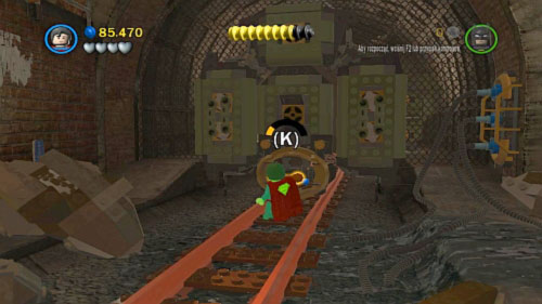 Get down move along tunnel and use Superman to pull the orange handle (picture) and continue march along tunnel - Underground Retreat - Walkthrough - LEGO Batman 2: DC Super Heroes - Game Guide and Walkthrough