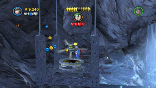 #05 - Fly up above rock on the left and you reach another minikit - Unwelcome Guests - Minikits - LEGO Batman 2: DC Super Heroes - Game Guide and Walkthrough