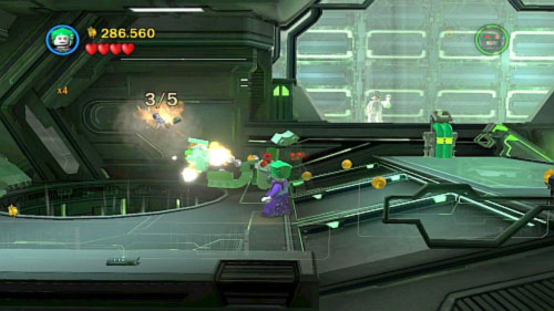 #09 - In location with two flying enemies move to the doors on the left and use Joker on the gift - Destination Metropolis - Minikits - LEGO Batman 2: DC Super Heroes - Game Guide and Walkthrough