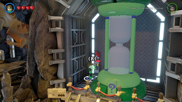 Go left and you will find an hourglass with Riddles logo - Side quests - Batcave - secrets - LEGO Batman 3: Beyond Gotham - Game Guide and Walkthrough