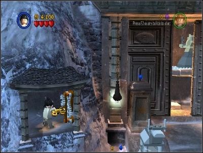 Jump with Marion on the ledge and use the mechanism which will open the gate - Chapter 2 - Into the Mountains - part 2 - Riders of the Lost Ark - LEGO Indiana Jones: The Original Adventures - Game Guide and Walkthrough