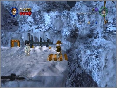 Jump using your whip to the right side, destroy the wooden barrel and make a pass for Marion - Chapter 2 - Into the Mountains - part 1 - Riders of the Lost Ark - LEGO Indiana Jones: The Original Adventures - Game Guide and Walkthrough
