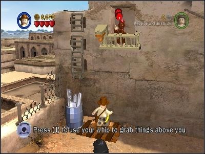 Use your whip under the monkey to destroy the barrier - Chapter 3 - City of Danger - part 2 - Riders of the Lost Ark - LEGO Indiana Jones: The Original Adventures - Game Guide and Walkthrough