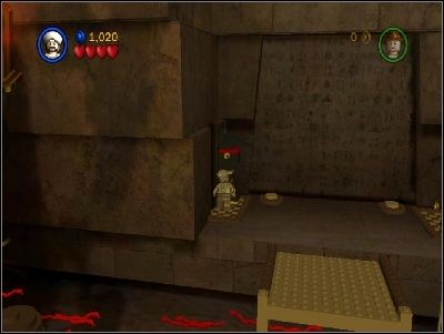 Change your character to Sallah, jump above the gap and push forward two monuments on the left and right side of the gate - Chapter 4 - The Well of Souls - part 1 - Riders of the Lost Ark - LEGO Indiana Jones: The Original Adventures - Game Guide and Walkthrough