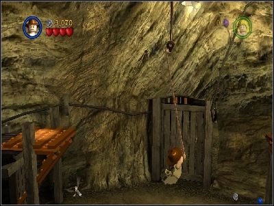 As Indy get on the repaired lift and use your whip on highlighted place - Chapter 4 - Free the Slaves - part 2 - The Temple of Doom - LEGO Indiana Jones: The Original Adventures - Game Guide and Walkthrough
