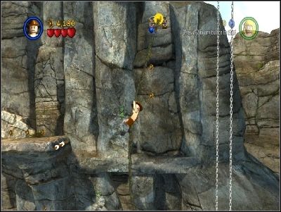As Indy, jump to the right using your whip and climb up using rope - Chapter 6 - Battle on the Bridge - The Temple of Doom - LEGO Indiana Jones: The Original Adventures - Game Guide and Walkthrough