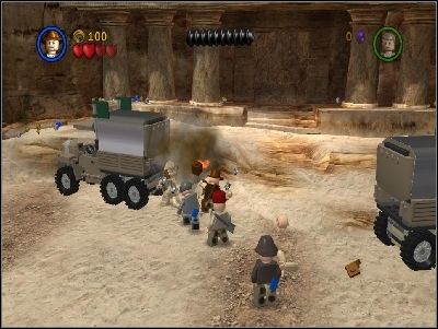 Defeat enemies and destroy the bars holding the trailers to stop enemies from spawning - Chapter 6 - Temple of the Grail - part 1 - The Last Crusade - LEGO Indiana Jones: The Original Adventures - Game Guide and Walkthrough