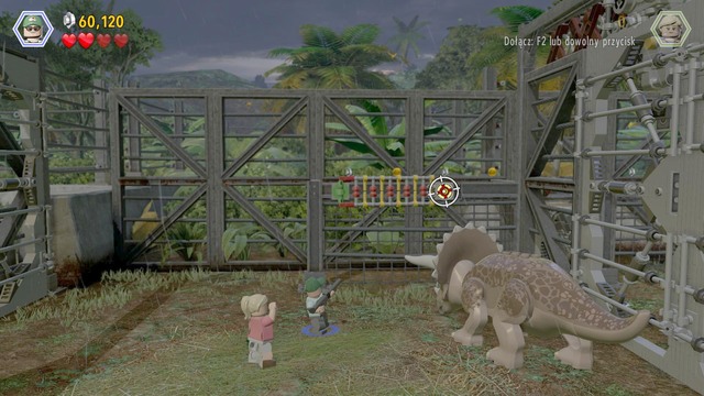 After you have opened the gate, as the park employee, and fire your gun at the target shown in the screenshot - Welcome to Jurassic Park - Jurassic Park - walkthrough - LEGO Jurassic World - Game Guide and Walkthrough
