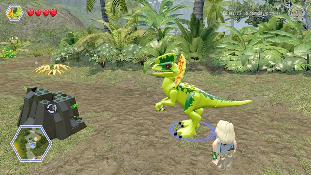 Walk to the dark rock and destroy it as dilophosaurus - Jurassic Park Gate - Jurassic Park - secrets in free roam - LEGO Jurassic World - Game Guide and Walkthrough