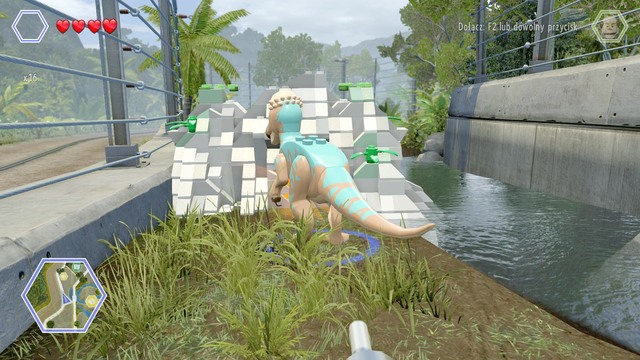 Walk to the left side as pachycephalosaurus and destroy the road barricade shown on the picture - Carnivore Territory - Jurassic Park - secrets in free roam - LEGO Jurassic World - Game Guide and Walkthrough