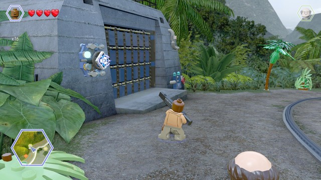 Shoot the blue shield as Barry and enter the darkened garage as Timmy - Carnivore Territory - Jurassic Park - secrets in free roam - LEGO Jurassic World - Game Guide and Walkthrough