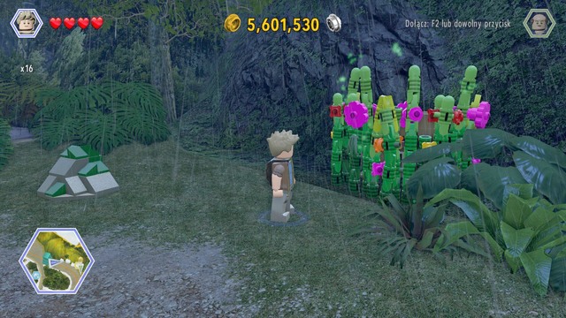 After getting to the road, go to the plants shown on the picture and cut them as Grant - Carnivore Territory - Jurassic Park - secrets in free roam - LEGO Jurassic World - Game Guide and Walkthrough