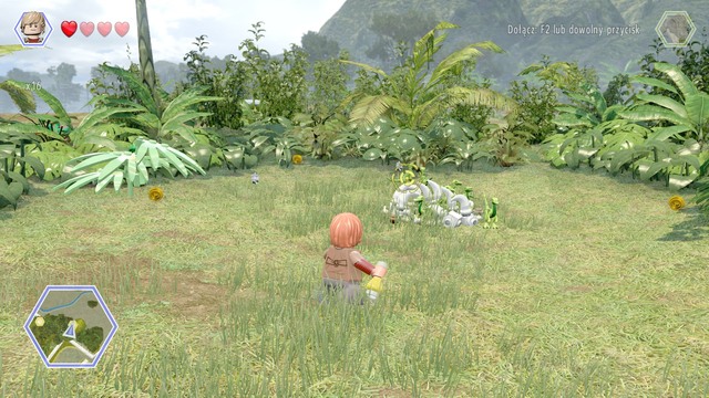 As Eric, walk to the compsognathuses and throw tyrannosaurus smell at them - Triceratops Territory - Jurassic Park - secrets in free roam - LEGO Jurassic World - Game Guide and Walkthrough