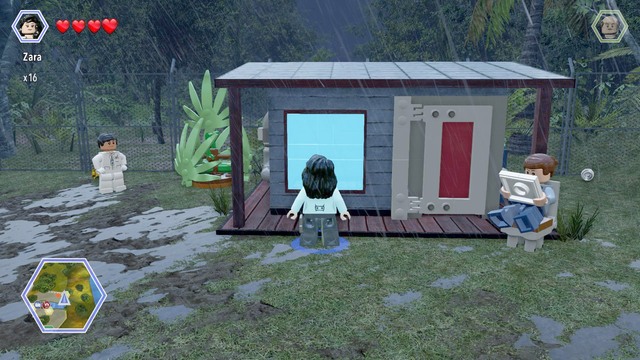 As Zara, walk to the window shown on the picture and break it with a scream - East Dock Route - Jurassic Park - secrets in free roam - LEGO Jurassic World - Game Guide and Walkthrough