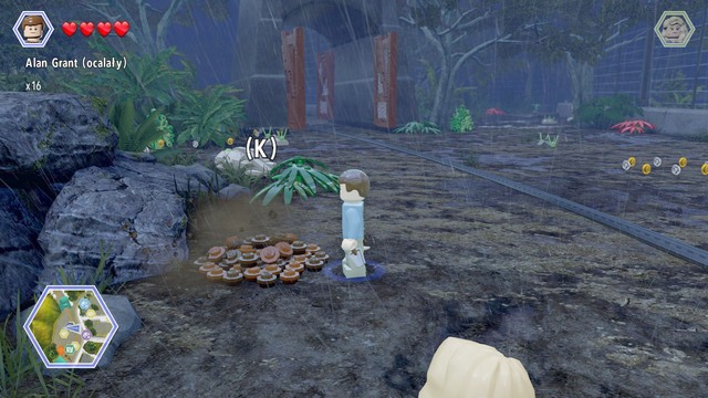 As Grant, walk to the pile of ground shown on the picture and dig up the bricks from it - Tyrannosaurus Enclosure - Jurassic Park - secrets in free roam - LEGO Jurassic World - Game Guide and Walkthrough