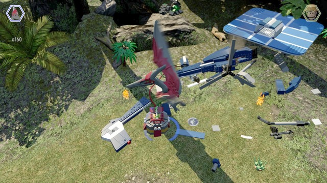 Fly as pteranodon to the helicopter wreck and hang on the rod shown on the picture in order to save the worker - Isla Nublar Aviary - Jurassic World - secrets in free roam - LEGO Jurassic World - Game Guide and Walkthrough