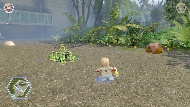 As Eric, throw the tyrannosaurus smell to scare the compsognathuses away - Indominus Territory - Jurassic World - secrets in free roam - LEGO Jurassic World - Game Guide and Walkthrough