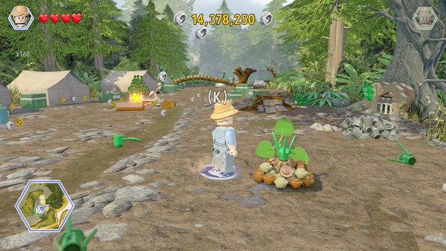 As Ellie, walk to the plant shown on the picture and water it up - Hunter Camp - Jurassic Park - The Lost World - secrets in free roam - LEGO Jurassic World - Game Guide and Walkthrough