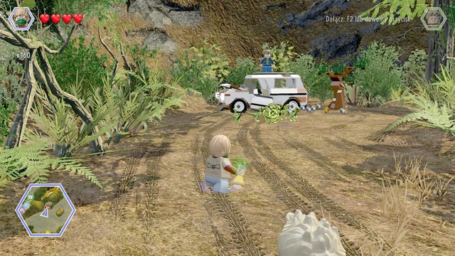 Walk to the car as Eric and throw the tyrannosaurus smell at the compsognathuses - Hunting Plains - Jurassic Park - The Lost World - secrets in free roam - LEGO Jurassic World - Game Guide and Walkthrough