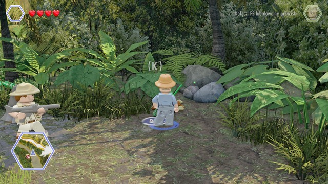 As Ellie, walk to the plant and water it up - Long Grass - Jurassic Park - The Lost World - secrets in free roam - LEGO Jurassic World - Game Guide and Walkthrough