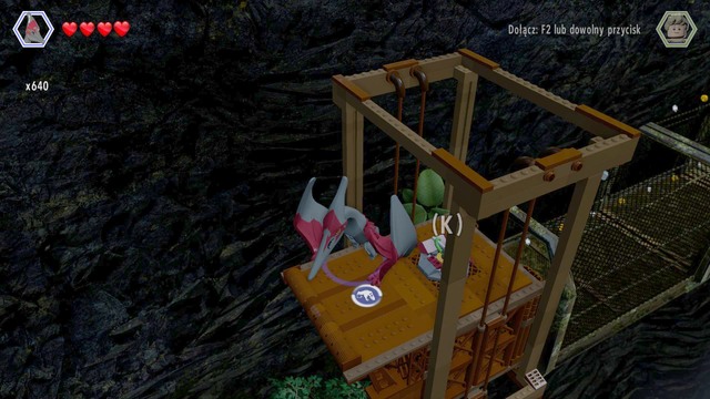 Fly on the elevator shown on the picture and use the lever - Isla Sorna Aviary - Jurassic Park III - secrets in free roam - LEGO Jurassic World - Game Guide and Walkthrough