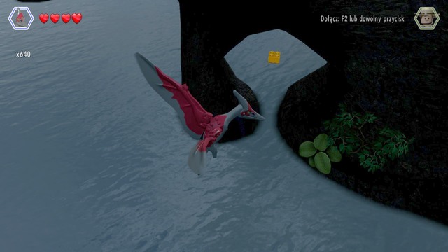 Fly under the rock with the required altitude to receive another golden brick - Isla Sorna Aviary - Jurassic Park III - secrets in free roam - LEGO Jurassic World - Game Guide and Walkthrough