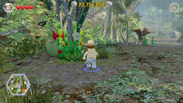 As Grant, walk to the plants blocking the access and cut them - Crash Site - Jurassic Park III - secrets in free roam - LEGO Jurassic World - Game Guide and Walkthrough